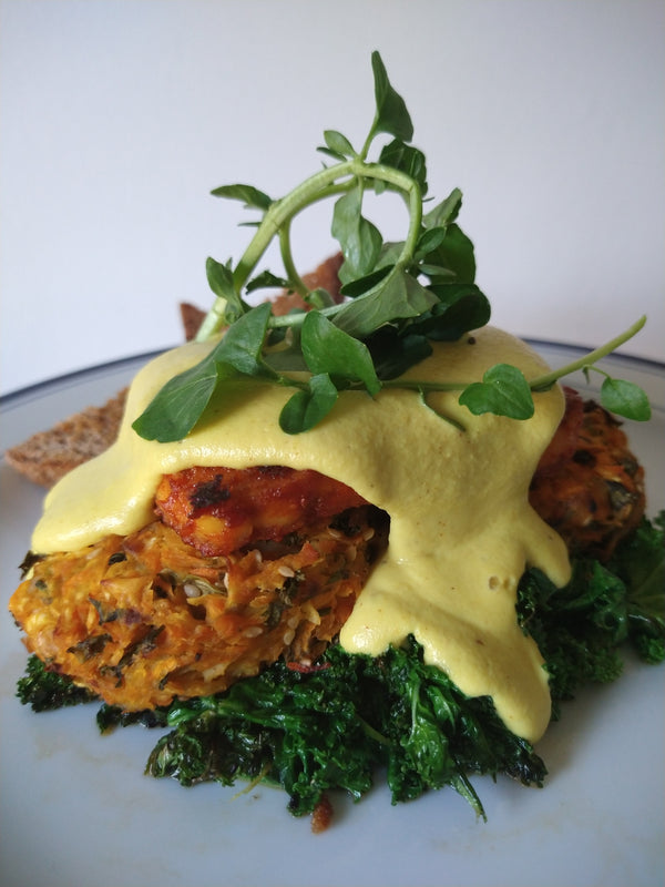 Vegan Benny with smoky bacon tofu, hollandaise and wilted greens
